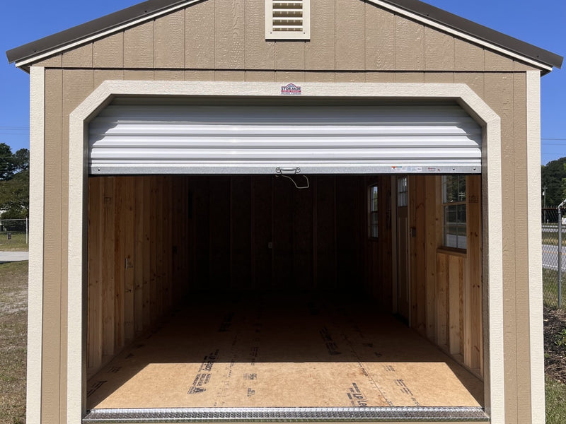 Outland Trailers 12x24 garage with metal walls and roof, double doors, and side vents for durable storage and workspace.