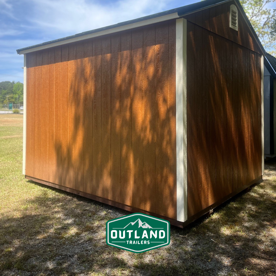 Outland Trailers 10x12 utility shed with durable metal construction, featuring a spacious design for storage and outdoor equipment.