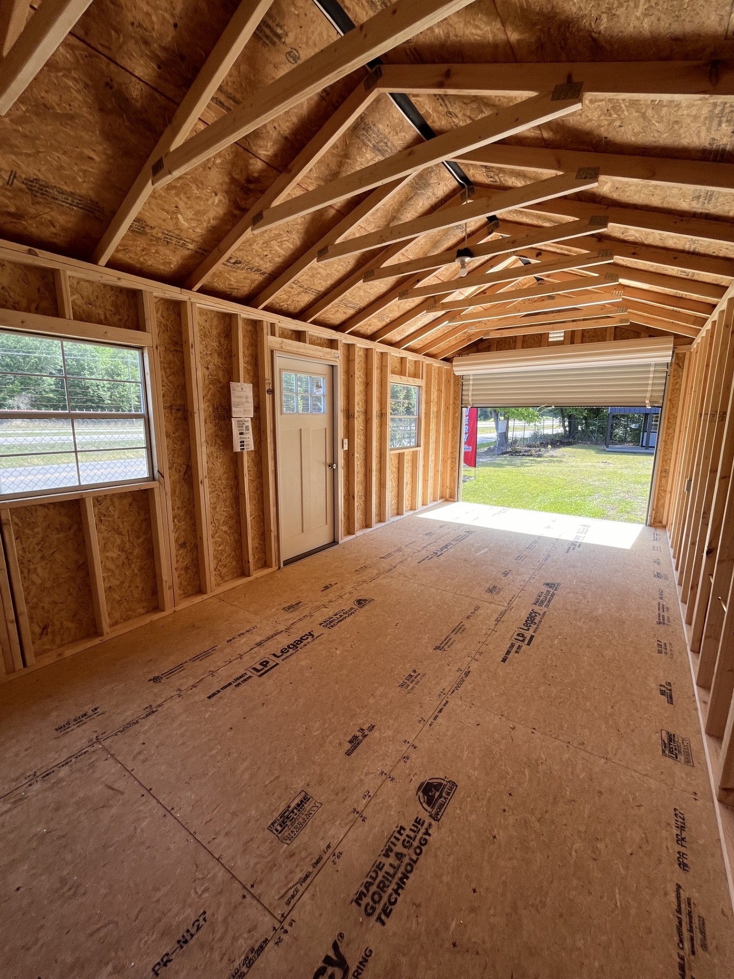 Outland Trailers 12x24 garage with metal walls, double doors, and a sturdy roof, ideal for storage or workshop needs