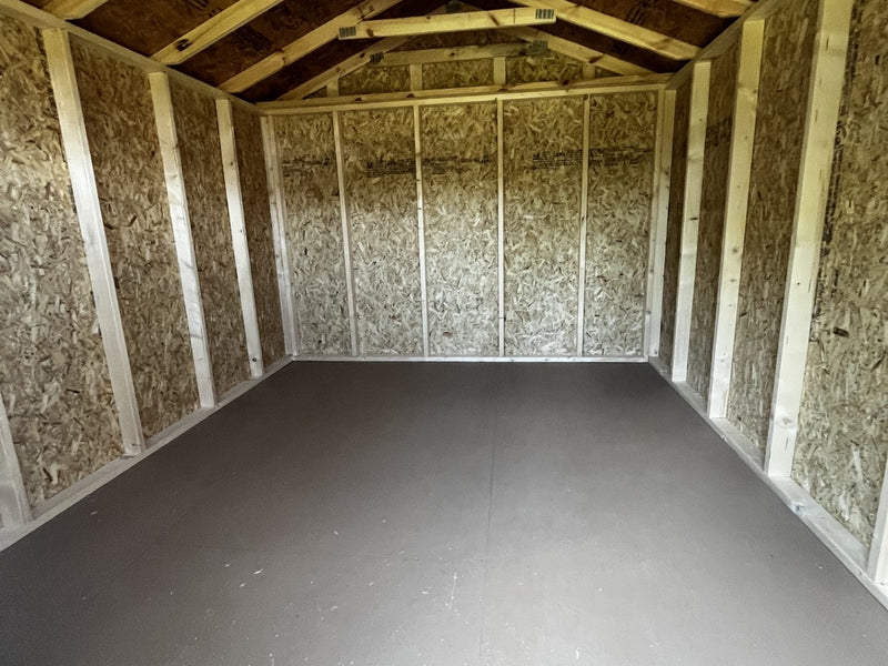 Outland Trailers 10x12 utility shed with double doors and metal siding, ideal for storage and yard organization