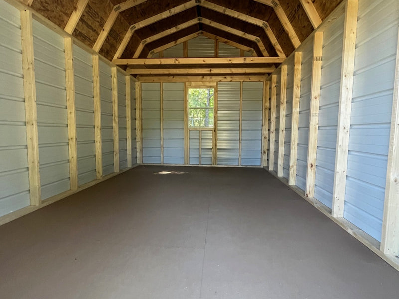 Outland Trailers 10x16 metal lofted barn with gable roof, side door, and ventilation for storage or workshop use