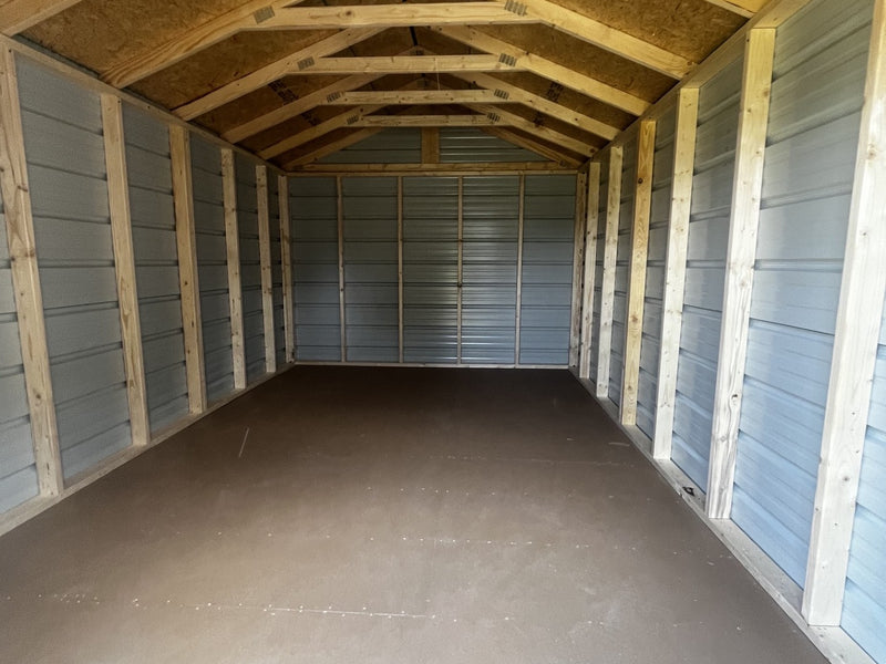 Outland Trailers 10x16 metal utility shed with sturdy construction and secure doors, ideal for outdoor storage and organization.
