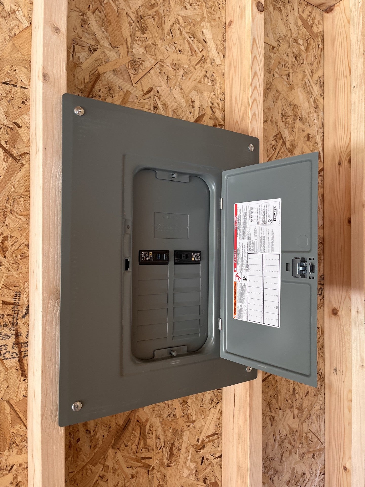 Outland Trailers 12x24 garage with sturdy metal walls and door, ideal for vehicle storage and workshop use.