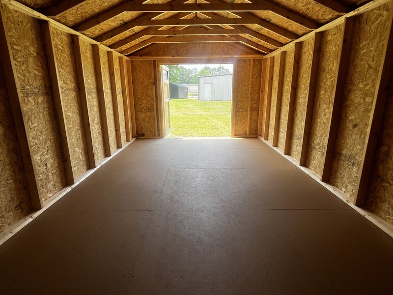 Outland Trailers 12x20 utility shed with durable metal construction and side door for storage and organization.