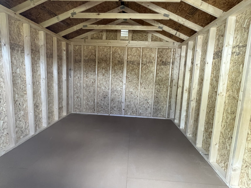 Outland Trailers 10x12 garden shed with double doors and weather-resistant construction, ideal for outdoor storage solutions.