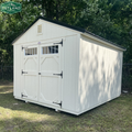 Outland Trailers 10x12 garden shed with double doors and window for outdoor storage and gardening tools.