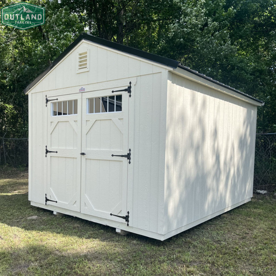 Outland Trailers 10x12 garden shed with double doors and window for outdoor storage and gardening tools.