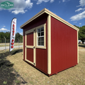 Outland Trailers 8x10 Cottage Shed with white walls and black roof, ideal for storage or small workshops.