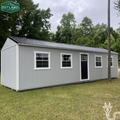 Outland Trailers 12x36 tiny home shell with wooden exterior walls and roof, ready for customization and interior finishing.
