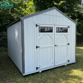 Outland Trailers 10x12 utility shed with sturdy metal construction and overhang for storage and outdoor organization.