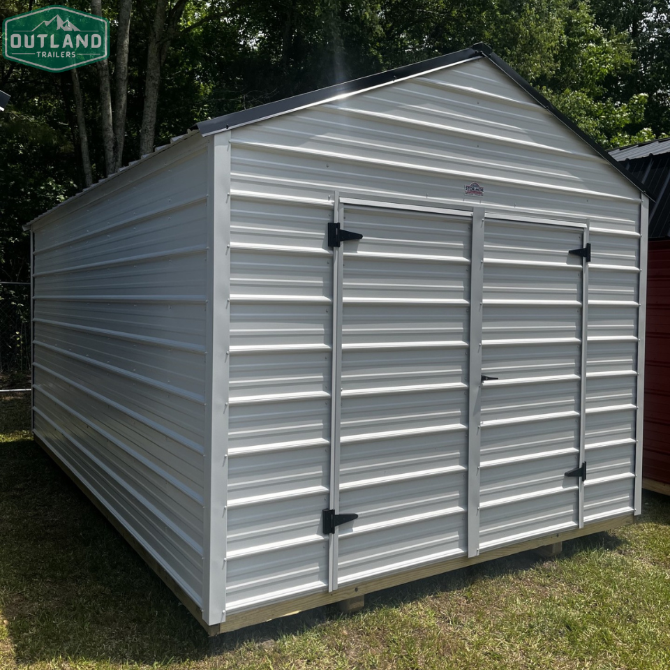 Outland Trailers 10x16 metal utility shed with double doors and vented roof, suitable for storage and outdoor use.