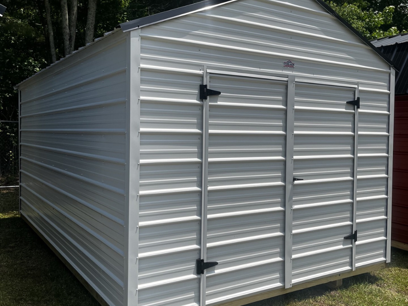 Outland Trailers 10x16 metal utility shed with double doors and vented roof, suitable for storage and outdoor use.