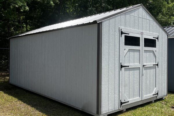 Outland Trailers 12x20 utility shed with double doors, durable metal construction, and ample storage space for tools and equipment.