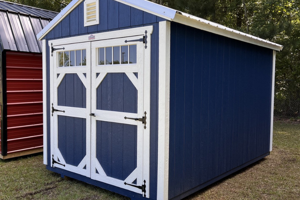 Outland Trailers 8x12 garden shed with double doors and wooden exterior for outdoor storage solutions.