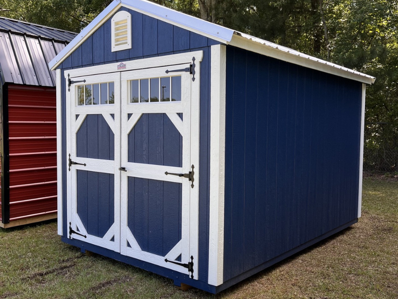 Outland Trailers 8x12 garden shed with double doors and wooden exterior for outdoor storage solutions.
