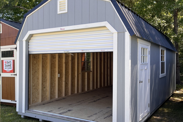 Outland Trailers 12x24 lofted garage with metal siding and double doors, ideal for storage and workshop space.