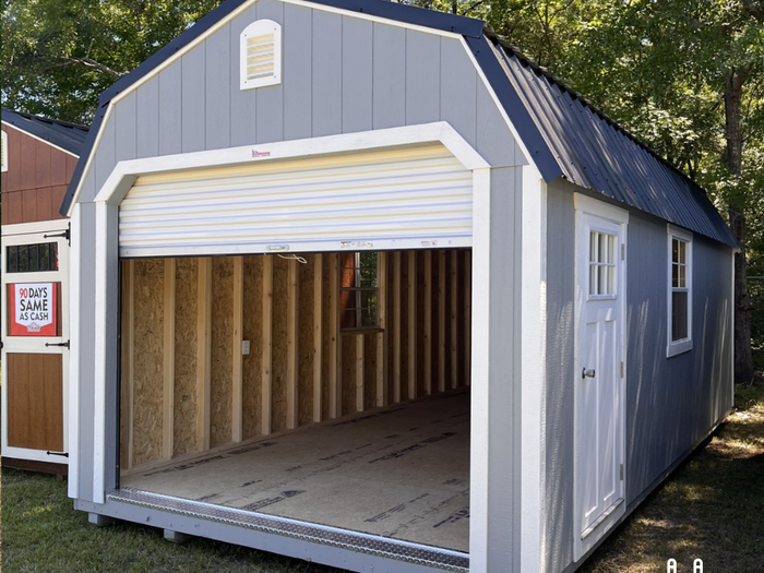 Outland Trailers 12x24 lofted garage with metal siding and double doors, ideal for storage and workshop space.