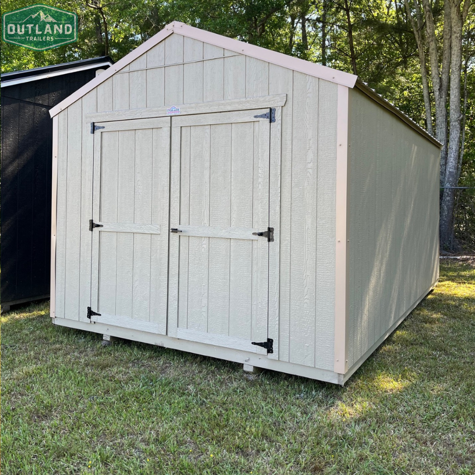 Outland Trailers 10x16 Tru-Valu utility shed with double doors and sturdy metal construction, ideal for storage and outdoor use.