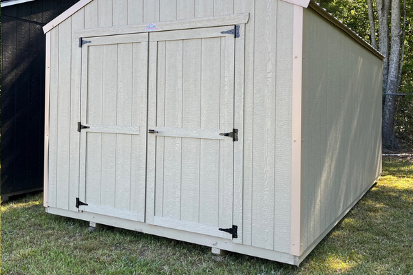 Outland Trailers 10x16 Tru-Valu utility shed with double doors and sturdy metal construction, ideal for storage and outdoor use.