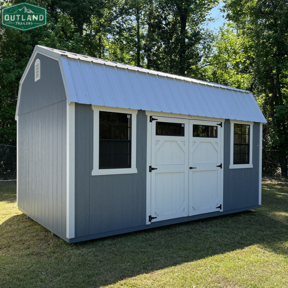 Outland Trailers 10x16 side lofted barn shed with vertical siding and double doors, showcasing durable storage design.