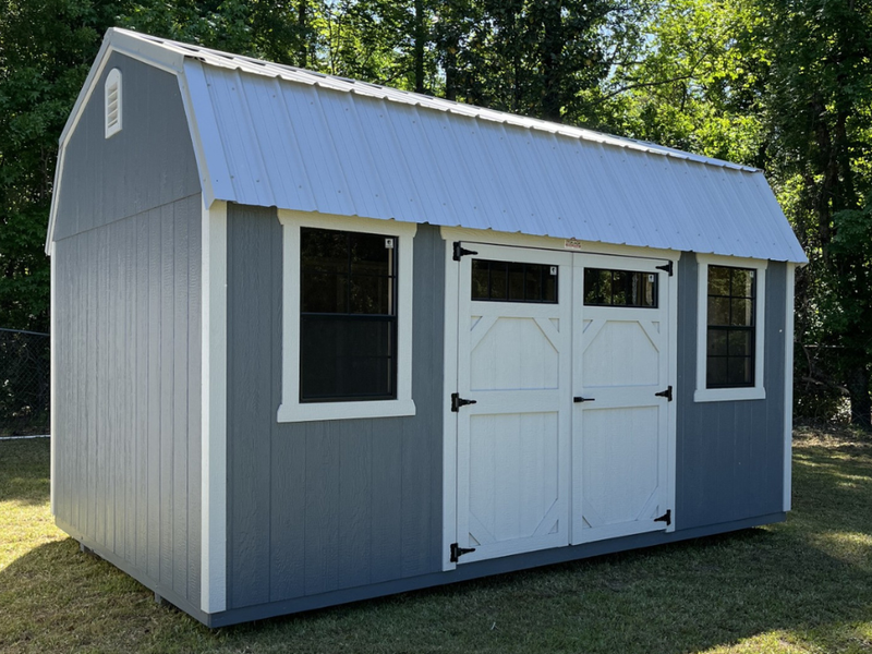 Outland Trailers 10x16 side lofted barn shed with vertical siding and double doors, showcasing durable storage design.