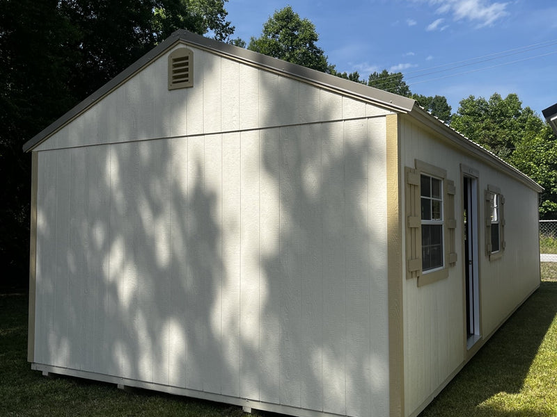 Outland Trailers 14x40 tiny home shell with wooden exterior, showcasing the compact, ready-to-finish tiny house structure.