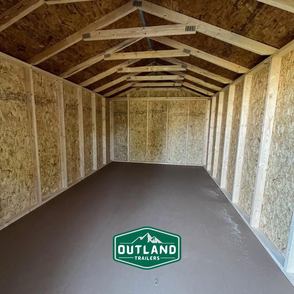 New Outland Trailers 10x16 Tru-Valu utility shed with metal construction and double doors, ideal for storage and outdoor use.