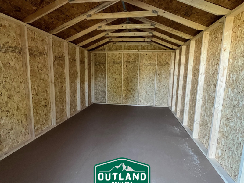 New Outland Trailers 10x16 Tru-Valu utility shed with metal construction and double doors, ideal for storage and outdoor use.