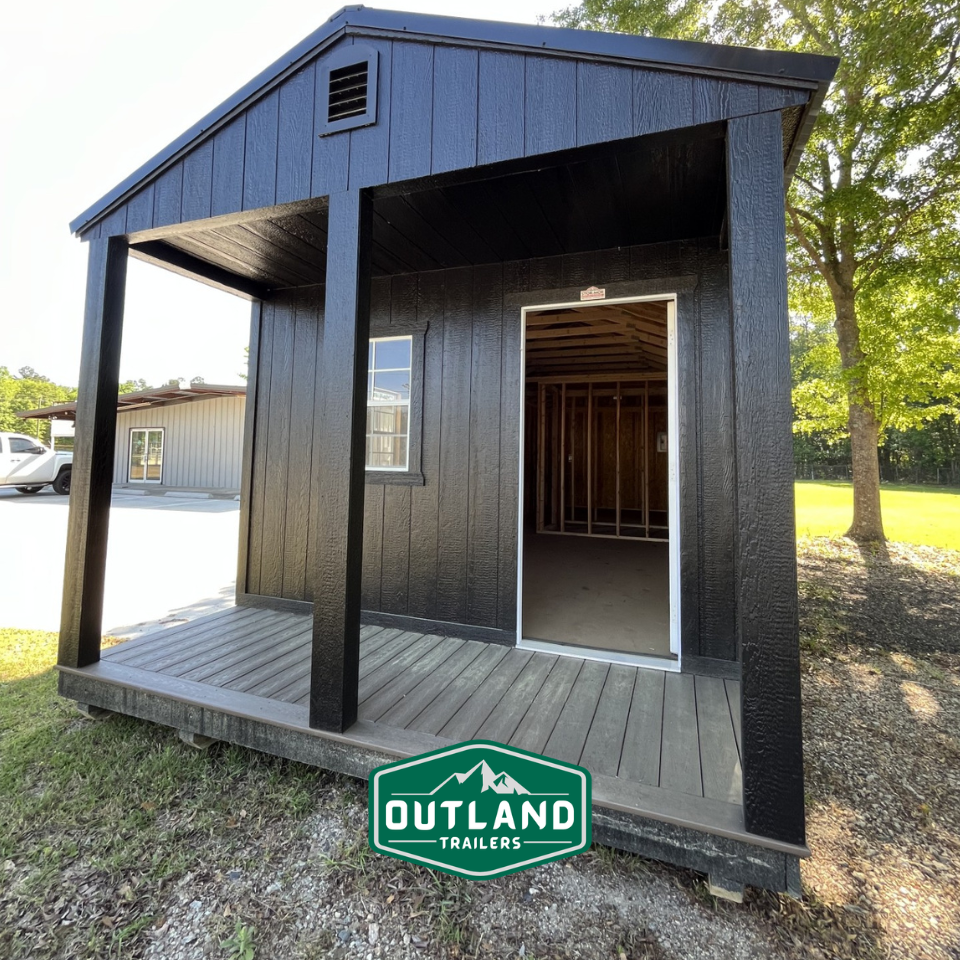 Outland Trailers 12x36 Cabin trailer with sturdy wooden walls and reinforced frame, ideal for camping or mobile storage.