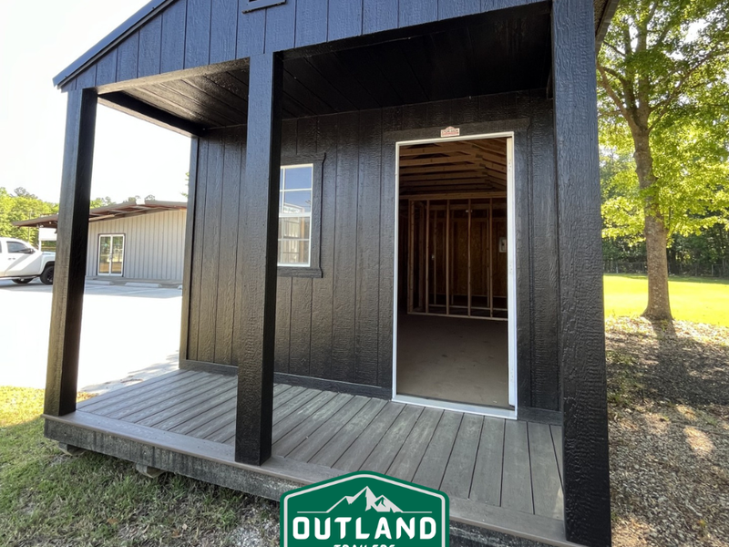 Outland Trailers 12x36 Cabin trailer with sturdy wooden walls and reinforced frame, ideal for camping or mobile storage.